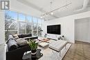 living room w/floor to ceiling windows