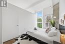 2nd bedroom w/floor to ceiling windows
