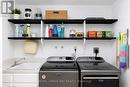 Laundry closet with sink
