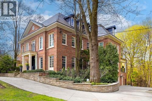 Brick exterior residence with a slate-style mansard roof