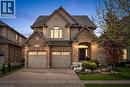 Traditional-style facade featuring brick and stucco elements.