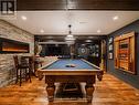 Games Room With Wall Hanging Electric Fireplace