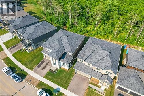 Contemporary residential architecture featuring multi-gabled roofs and attached garages