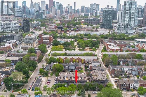 Aerial shot w/ arrow indicating property location