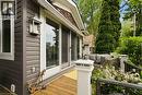 Exterior siding in a horizontal profile with white trim windows and a sliding glass door