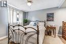Bedroom featuring light gray wall paint and carpeted flooring