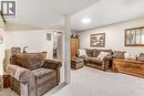 Carpeted room with recessed lighting