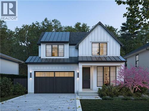 Modern farmhouse exterior featuring vertical white siding and black-trimmed windows