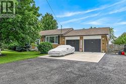 Brick exterior with a brown shingle roof