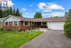 Paved lane leading to single car garage