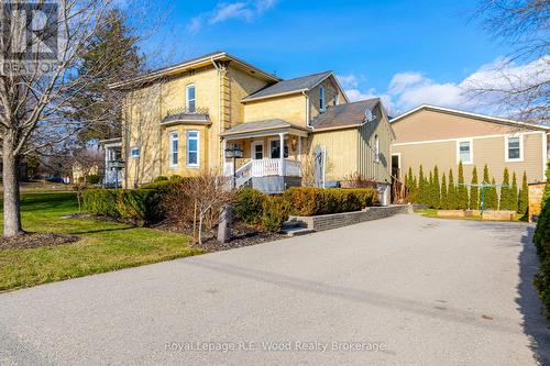 Asphalt drive, landscaped concrete patio + porch!
