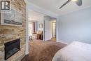 Primary Bedroom with fireplace open to Den