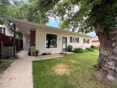 One level living with double detached garage - across the street from lovely Central Park in Melita MB!