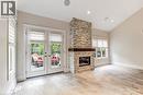 Open-concept dining area chandelier lighting, and light wood-finish flooring.  AI staging.