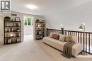 balcony overlooking open concept living room/kitchen area