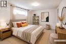 Laundry area main floor, featuring white cabinetry, a stainless steel sink with a chrome faucet, and a light-toned countertop, lot of storage, access to garage, appliances included