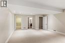 2nd floor, carpeted room featuring a large window, recessed lighting, and a neutral colour palette