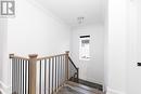 Upstairs with railing and crown molding