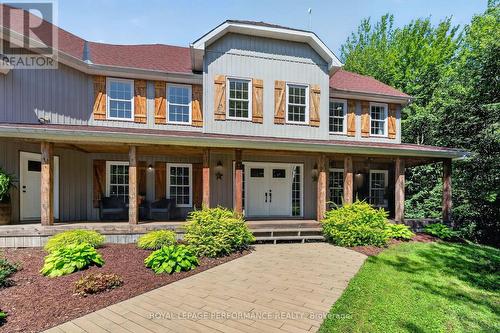 Amidst nearly six acres of treed private grounds