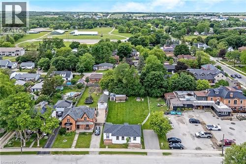 Aerial perspective showcasing a residential street with mature trees and established properties
