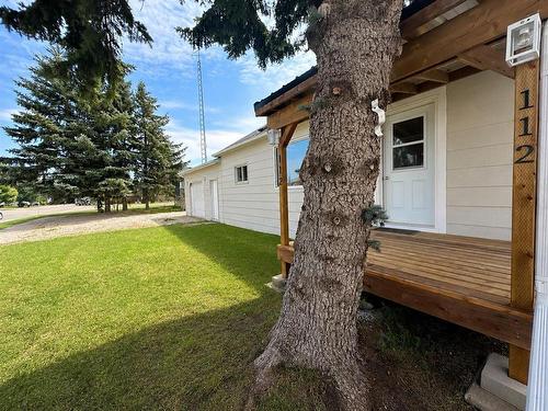 Attached garage with a lean-to on the far side.