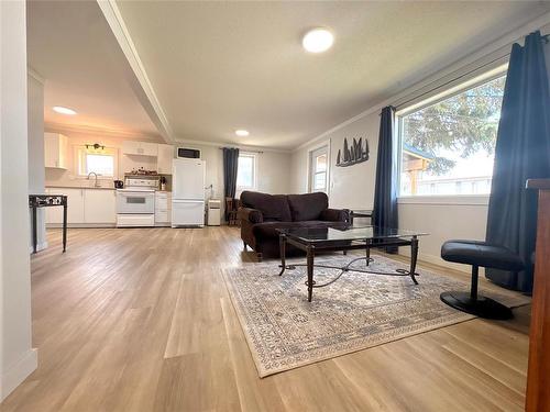 Main level of home with open concept living, dining and kitchen.