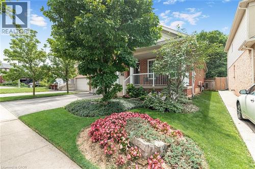 Brick exterior with a covered front porch featuring white railings