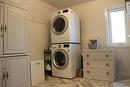 Third bedroom is presently used as a laundry room. One could move the laundry to the mudroom.