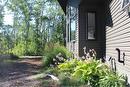This view is facing south. Beautiful perennials and again, low maintenace landscaping.