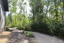 This walkway leads out to the driveway that is off Dalvik Road.