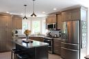 The kitchen has built-in microwave with 