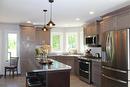 Another view of the kitchen with large island and beautiful window for lot's of natural light.