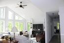 Stunning wall of windows allows for so much natural light. No need for blinds as the property is almost hidden from the road from all the trees.