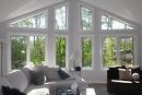 The living room features vaulted ceilings and this stunning wall of windows. Not a bad view...