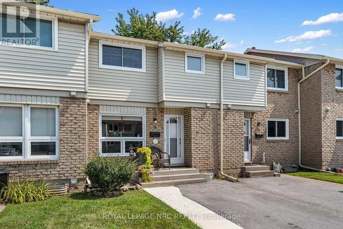 2-storey with a private drive and sidewalk