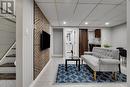 family room in lower level with accent wall