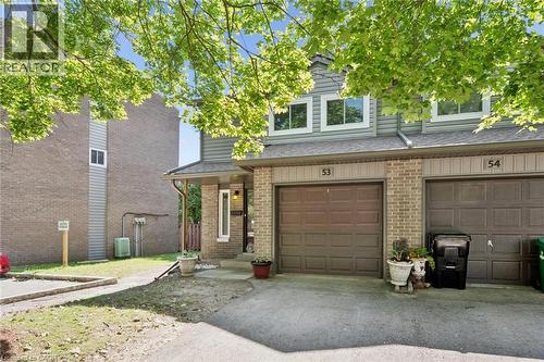 Brick and siding exterior with a covered entry