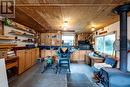 Detached Garage with electricity & wood stove.