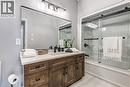 Wood vanity,  quartz countertop and rectangular sink, upgraded tile floor