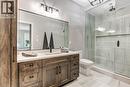 Ensuite shower with horizontal niche, quality tiles  with rain shower, Spacious vanity with quartz countertop and wood-finish cabinetry