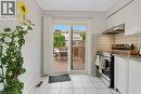 Kitchen with sliding door to deck and backyard