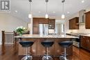 Rich cappuccino cabinetry with granite counters