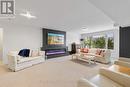 Bright Rec. room with linear electric fireplace