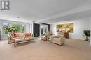 Bright recreation room with walkout to patio