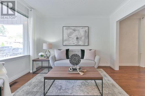 Light filled living room O/L dining