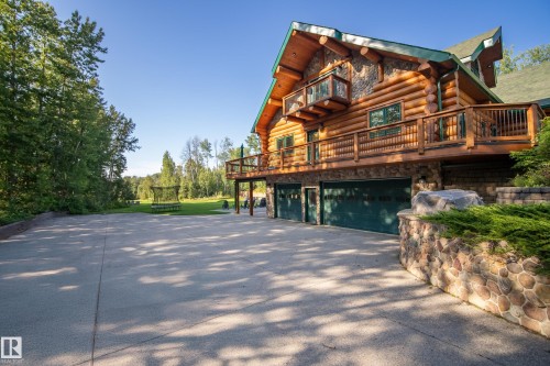 The home has an attached triple car garage that features in floor heating.