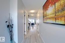 Corridor with baseboards and light wood finished floors