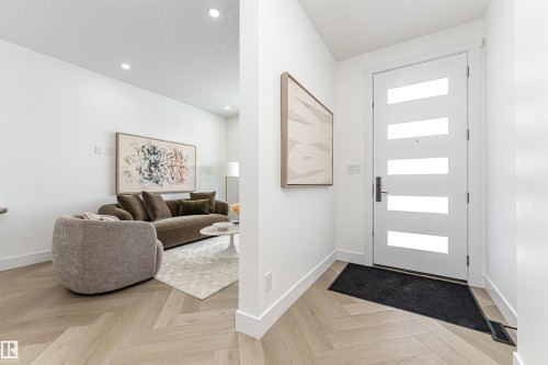 Foyer with a textured ceiling and recessed lighting