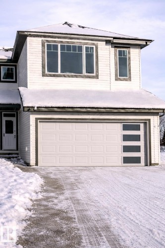 View of front of home featuring an attached garage