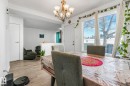 Dining space with suspended lighting and wood finished floors